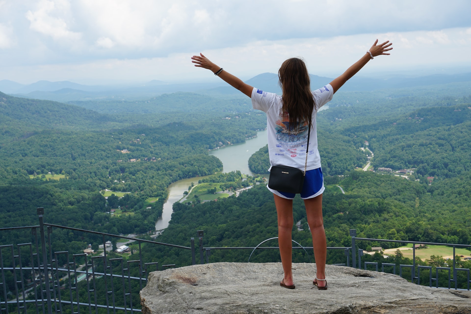 Woman hiking while yurt camping in nc